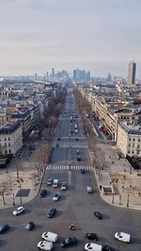 Aerial Paris cityscape with view to La Defense metropolitan district, France. Beautiful parisian architecture with historic buildings, landmarks and busy city streets with car traffic