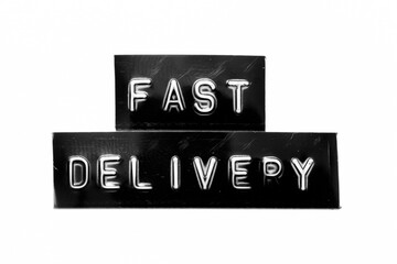 Black color banner that have embossed letter with word fast delivery on white paper background