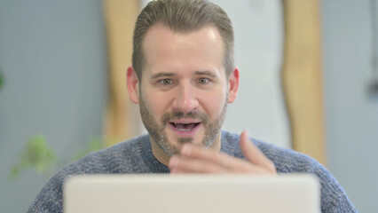 Close Up of Mature Adult Man Celebrating Success on Laptop