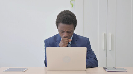 Young African Businessman Coughing at Work