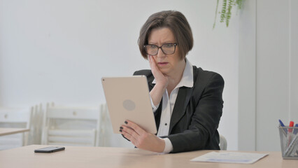 Senior Old Businesswoman Reacting to Loss on Digital Tablet
