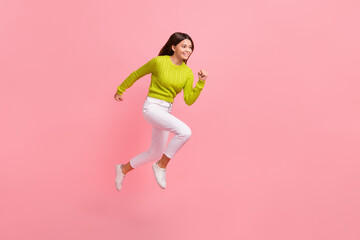 Fototapeta Full size photo of lovely teen lady jumping running sportive fast sales shopping wear trendy green look isolated on pink color background obraz