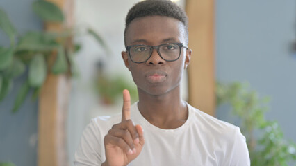 Fototapeta premium Portrait of Disliking Young African Man Shaking Head in Rejection