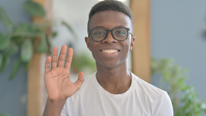 Young African Man Waving Hand to Say Hello For Video Call