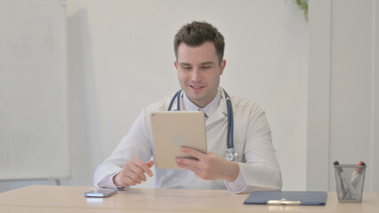 Young Doctor Doing Online Video Chat via Tablet