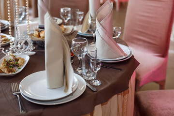 wedding decor.Wedding. Banquet. Chairs, table, flowers and crockery. Wedding decoration ceremony.