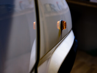 Auto workshop. Turn signal close up.