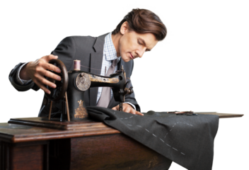 Confident young tailor sewing clothes in the tailor shop