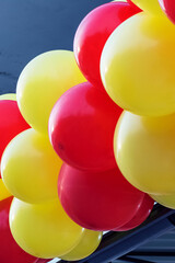 Yellow and red balloons on the building