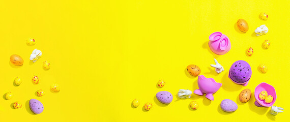 Happy Easter holiday background with eggs, cute rabbits and traditional decor. Sweet chocolate
