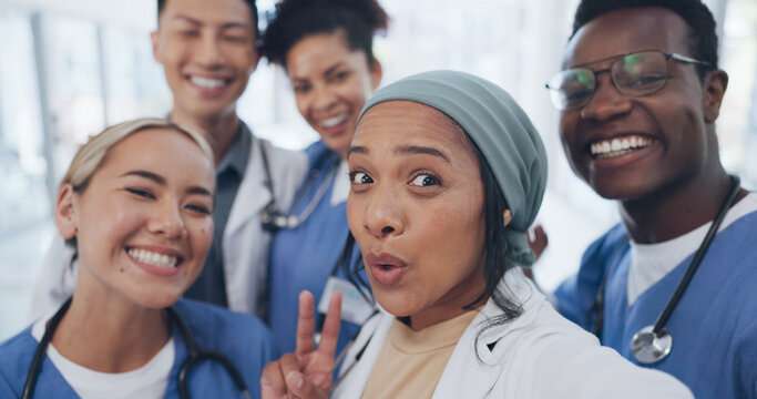 Doctors, friends and selfie in hospital for team building, solidarity or diversity for social media post. Doctor, group and teamwork with black man, women and peace for comic smile, happy and support