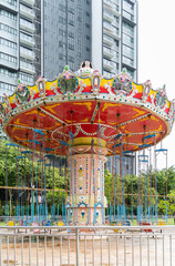 Fototapeta na wymiar Colorful swing ride at the amusement park