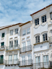 Authentic classical buildings with vintage facades downtown in Evora, Portugal. Verical photo