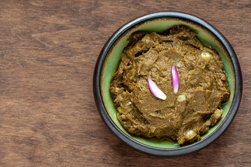 Sarson ka saag traditional Indian dish, cooked pureed mustard leaves. Homemade food meal.