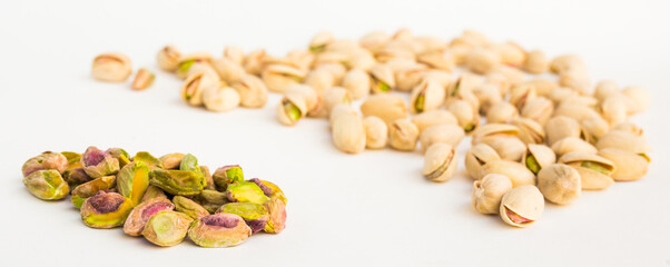roasted pistachios on white background