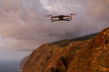 Fototapeta na wymiar A drone flying over landscapes and making beautiful pictures and videos.