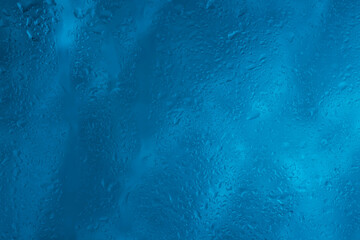Drops of rain water droplets on glass