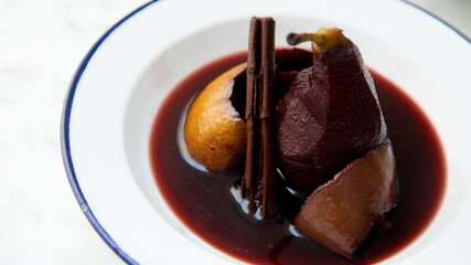 Pears cooked in red wine with orange.
