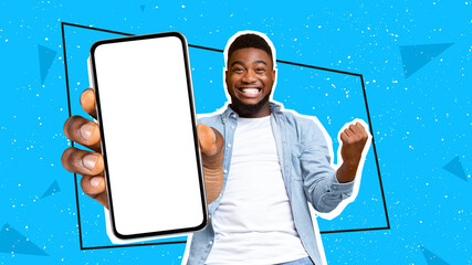 Black man celebrating success with clenched fist and cell phone