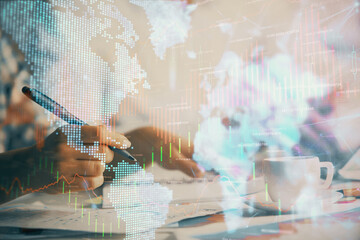 Double exposure of forex graph drawing over people taking notes background. Concept of financial analysis