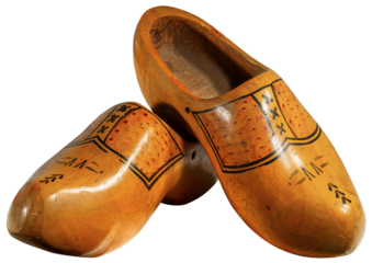 Close-up of a pair of wooden clogs made in Netherlands, isolated on white or transparent background, png, photography.