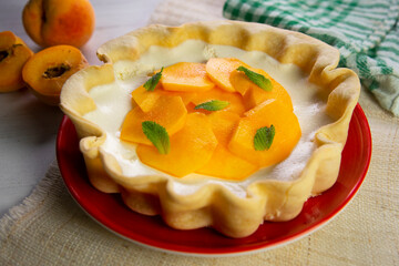 Peach cake made with a recipe with yogurt and fresh fruit.