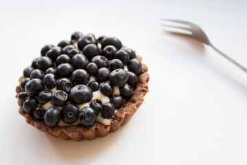 Tartlet with blueberries. Dessert with red fruits such as raspberries, strawberries, blackberries or blueberries.
