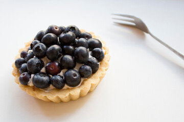 Tartlet with blueberries. Dessert with red fruits such as raspberries, strawberries, blackberries or blueberries.