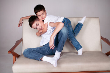 two boys sitting on the sofa
