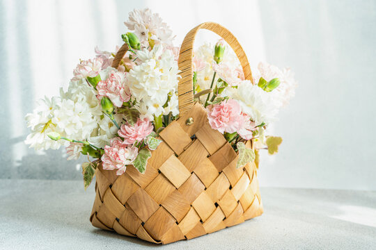 Beautiful straw bag with seasonal flowers