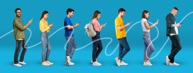 Cheerful young european people in casual typing on phones with connect line, isolated on blue...