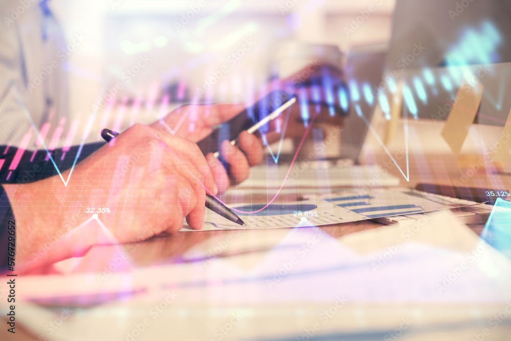 Aufkleber double exposure of man's hands holding and using a phone and financial chart drawing. market analysi