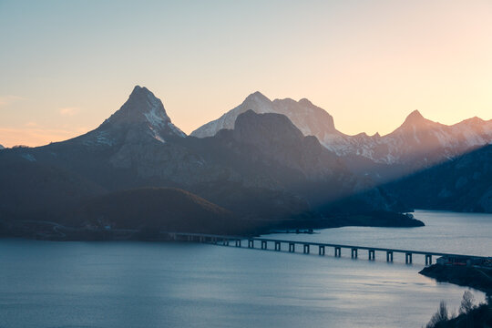 Picturesque view of mountain ridge and river with bridge - Powered by Adobe