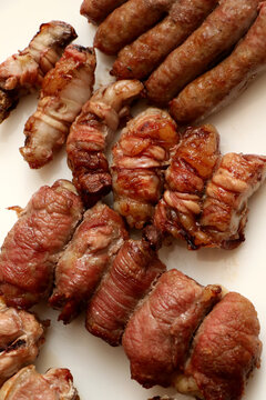 Mixed roast meat. Gnummareddi or torcinelli, rolls based on lamb offal, sausage and the famous bombette martinesi, meat rolls stuffed with cheese. Apulian food