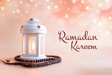 Ramadan background design colourful lantern lamp with tasbih isolated on beige background, Islamic...