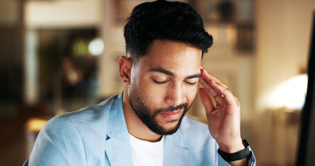 Stress, headache and businessman working on a computer for a project with a deadline in the office....