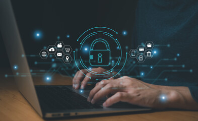 Men hand holding lock icon while using computer laptop with internet connection. Sign of cybersecurity protection to prevent from virus, cyber crime and digital threat to privacy and information.