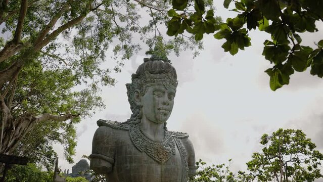 Statue of Vishnu head, face in Garuda Wisnu Kencana park, GWK, Bali, Indonesia. Concept of hinduism, vaishnavism, worship of spirits. Religious sculpture of veneration of the gods in close up