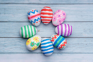 Easter eggs on pastel blue wooden background