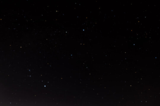 Summer triangle (Deneb, Vega, Altair) with line in dark night sky. Stellar summer triangle consisting of the brightest stars of constellations Swan, Lyra and Eagle: Deneb, Vega and Altair.