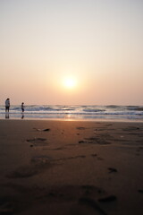Fototapeta na wymiar Vertical image of sunset on the beach