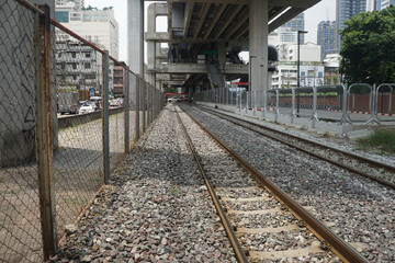 Fototapeta premium Railway under the expressway in Thailand. Railway Crush Stones (Ballast)