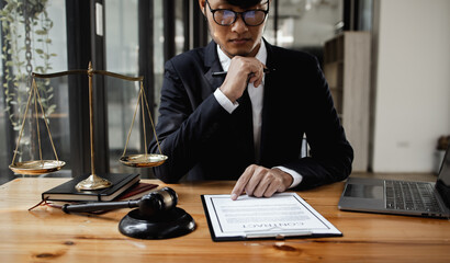 lawyer working with contract agreement at table office, law and justice concept, Selective focus.