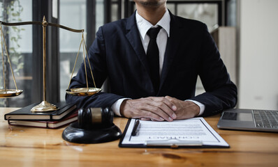 lawyer working with contract agreement at table office, law and justice concept, Selective focus.
