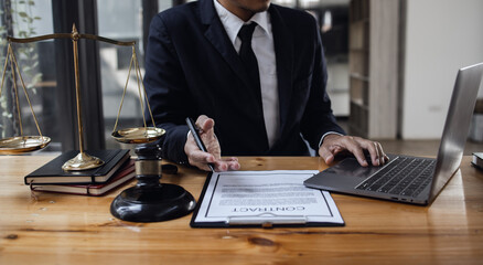 lawyer working with contract agreement at table office, law and justice concept, Selective focus.