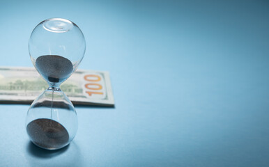 Hourglass and dollar. Time is money