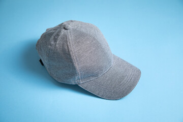 Baseball cap on the blue background.