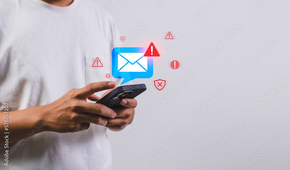 Leinwandbilder Businessman using smartphone with electronic email hacking and spam warning symbol. cyber attack network, virus, spyware, Cyber security and cybercrime