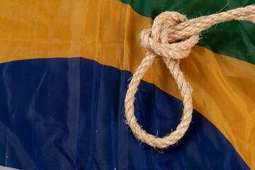 Rope with a noose over the Brazilian flag symbolizing slavery