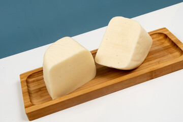 Minas half-cured cheese on a bamboo tray,
